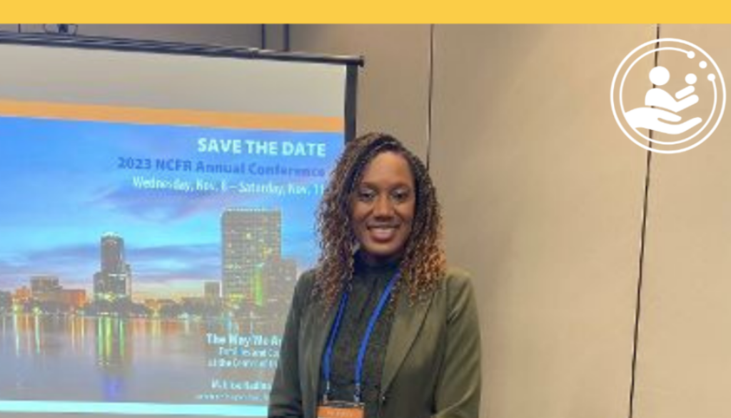 Dr, Rollins standing at a conference