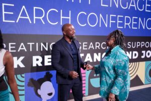 NAACFRC Annual Conference 2023 Dr. Washington and Danette McLaurin-Glass conversing on the Annual Conference main stage