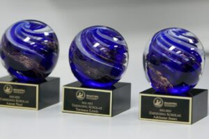 Emerging Scholar Awards line the table at the NAACFRC Annual Conference 2023